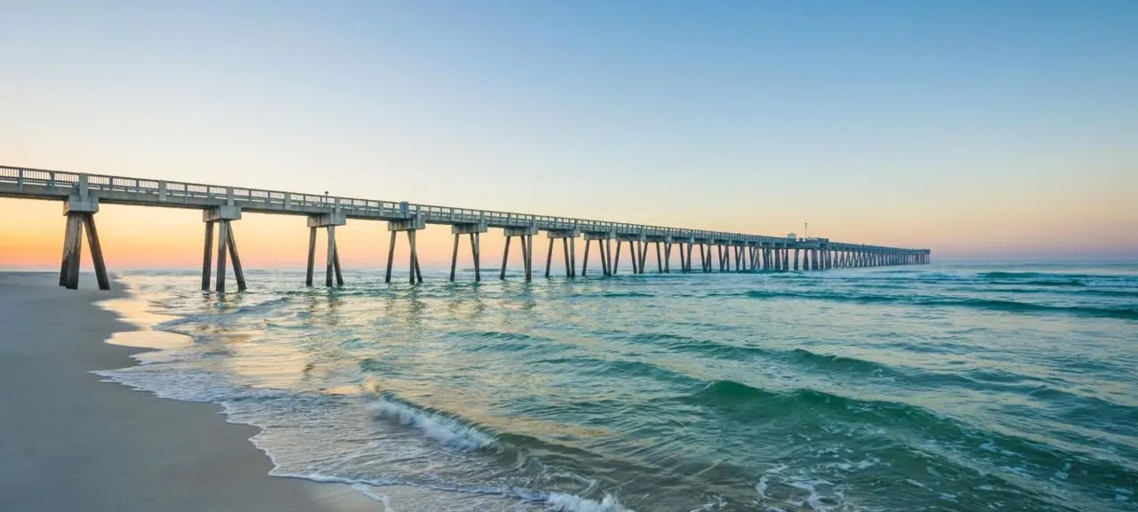 Fishing pier stretching over the ocean at sunrise on a North Carolina beach